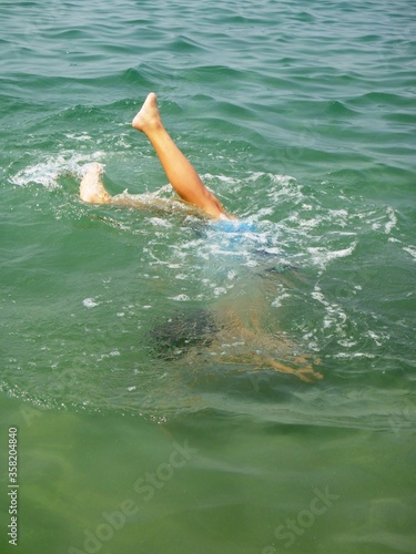 a boy swimming in the sea