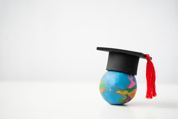 Learning and education play dough world and graduation hat copy space creative thinking improving learning studying skills, college university school graduation of employment business profession jobs