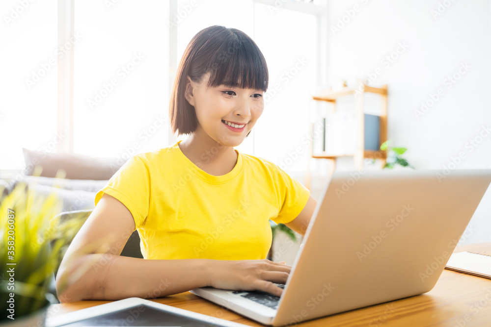 Online class learning student studying lockdown quarantine homeschooling and distance learning education, Asian beautiful girl living room study at home using computer laptop video call communication Online class learning student studying lockdown quarantine homeschooling and distance learning education, Asian beautiful girl living room study at home using computer laptop video call communication