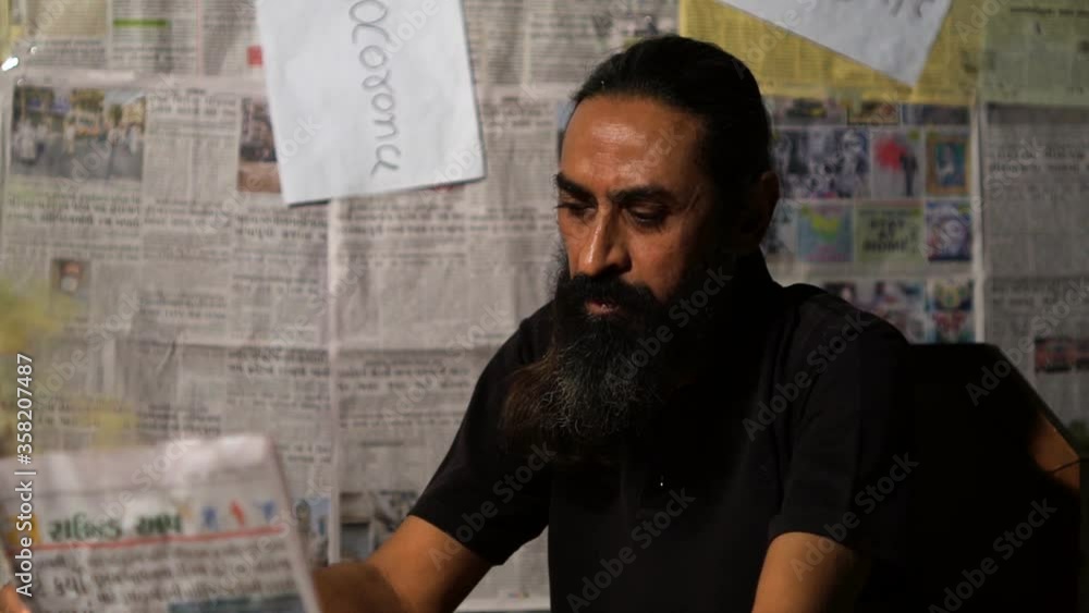 Man holding burning news paper in hands Man holding burning news paper in hands