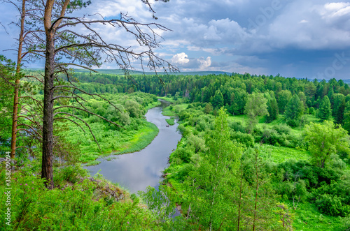 Photography People on an inflatable raft float on the river among the mountains and forests in summer