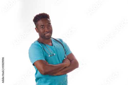 Handsome African doctor wearing scrubs