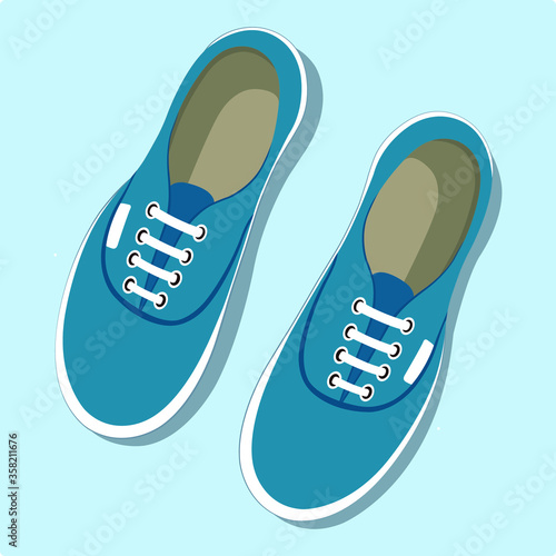 A pair of sneakers shoes.
Pair of blue sneakers.
Sneaker.