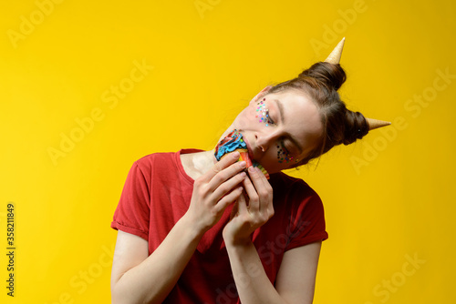 Photography young european woman with colorful cupcake