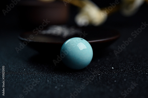 turquoise Jewel isolated against a black background