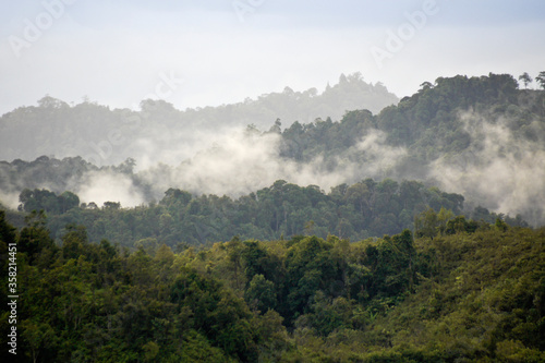 Mist rising from tropical forest after rainstorm at Batang Ai National Park, Sarawak (Borneo), Malaysia