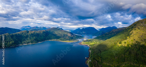 Fototapeta Naklejka Na Ścianę i Meble -  aerial image of the entrance to glencoe, ballachulish and loch leven from loch linnhe on the west coast of the argyll and lochaber region of the highlands of scotland on a clear blue sky summer day