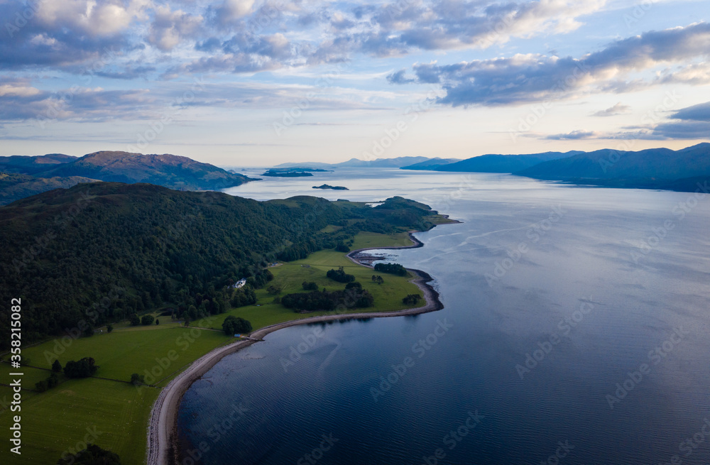 aerial image of loch linnhe on the west coast of the argyll and lochaber region of scotland near kentallen and duror showing calm blue waters and clear skies with green forest coast line aerial image of loch linnhe on the west coast of the argyll and lochaber region of scotland near kentallen and duror showing calm blue waters and clear skies with green forest coast line