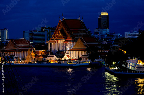 Thai temple by the river in the night