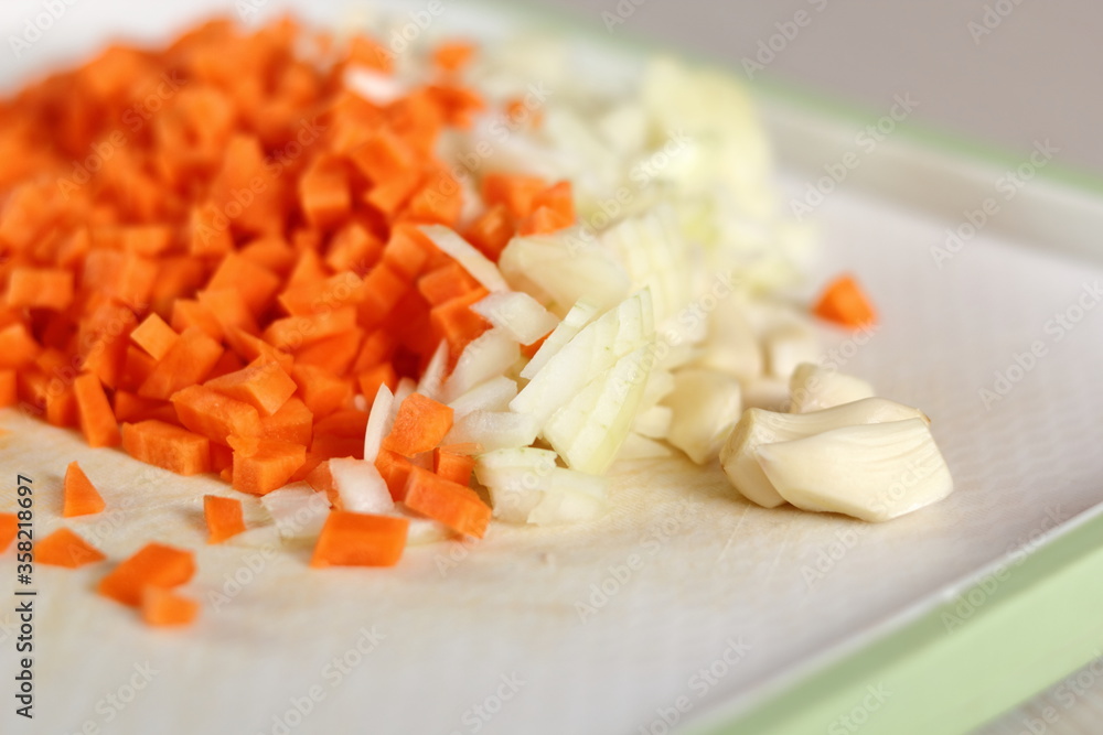 Diced carrot, onion and garlic. Making Lasagna Bolognese Series. Diced carrot, onion and garlic. Making Lasagna Bolognese Series.