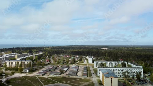 Aerial view of orthodox (Russian) St Nicholas Naval Cathedral golden domes and crosses in sunny day at Karosta, Liepaja, wide angle revealing drone shot moving backwards photo