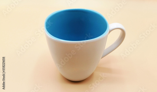 White ceramic coffee cup on background