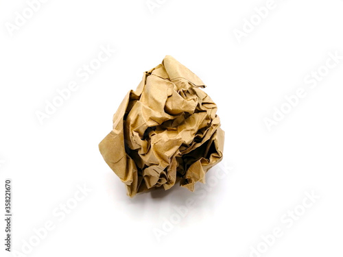 Crumpled brown paper is mauled on white blackground photo