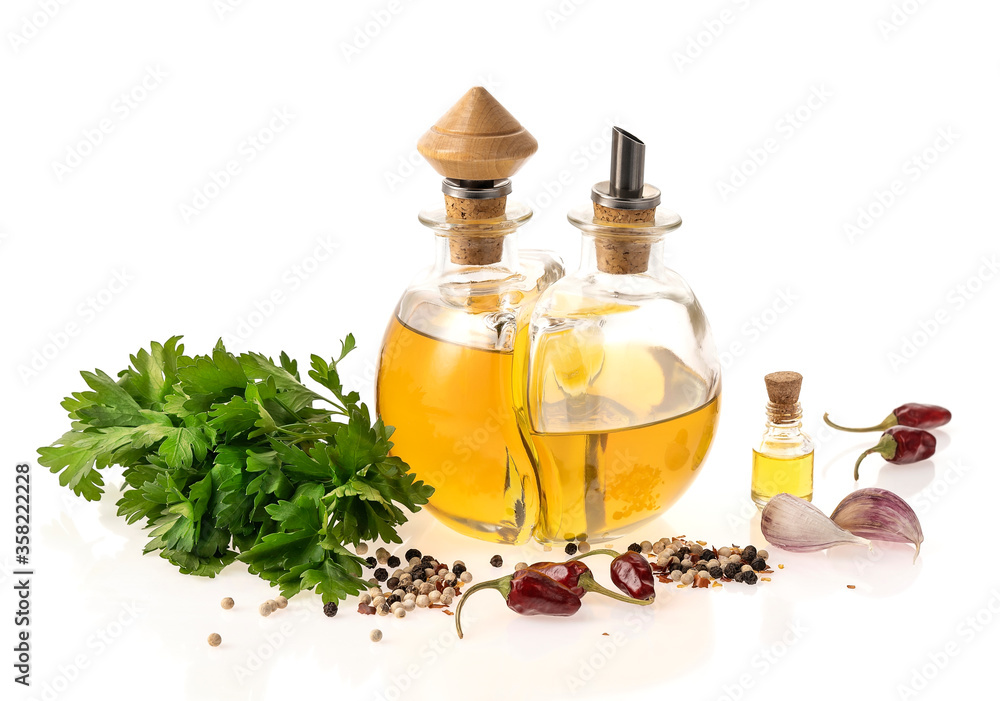 Italian cuisine. Olive oil with spices on a white background. Italian cuisine. Olive oil with spices on a white background.