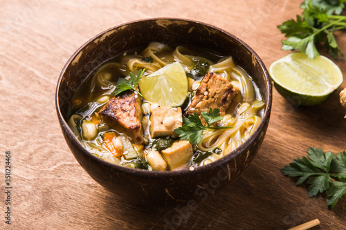 Miso Ramen Asian noodles soup with tempeh or tempe in a bowl. Health food for healthy eating for vegans & vegetarians. A close-up view of Chinese noodle soup