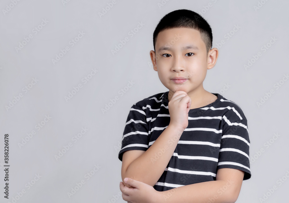Asian boys studio portrait on gray background Asian boys studio portrait on gray background