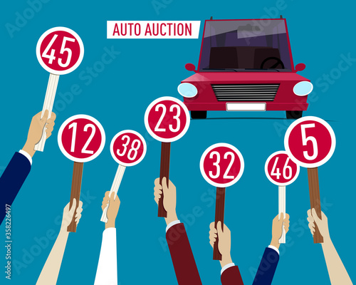 Auto Auction concept: Hands holding paddle with numbers