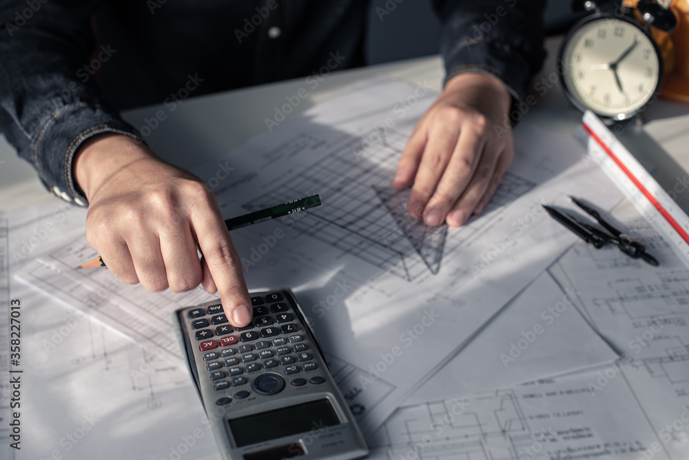 Architect working on blueprint. Architects workplace - architectural ...