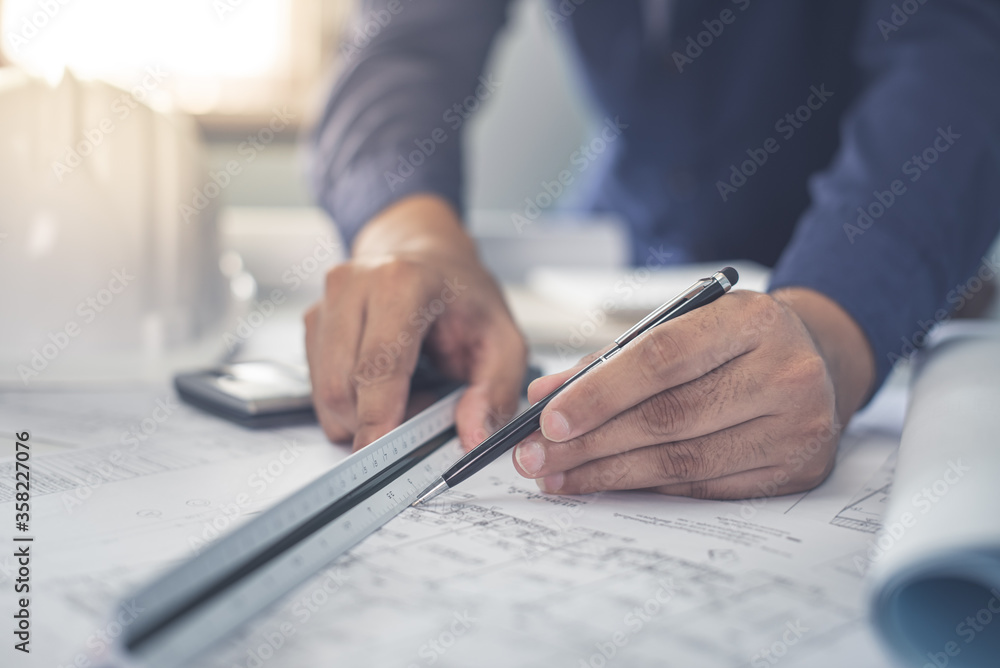 Architect working on blueprint. Architects workplace - architectural ...