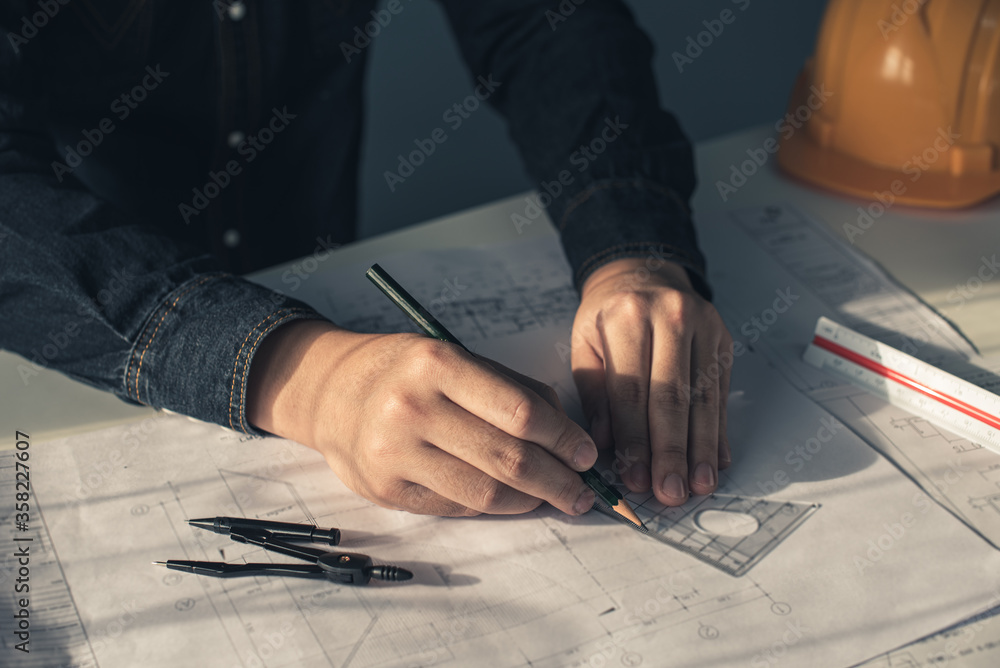 Architect working on blueprint. Architects workplace - architectural ...