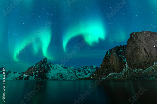 Aurora borealis or North light over Hamnoy village in Lofoten island, Nordland in Norway, Scandinavia