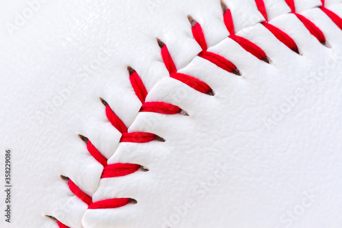 Macro of a baseball surface with stitching. photo