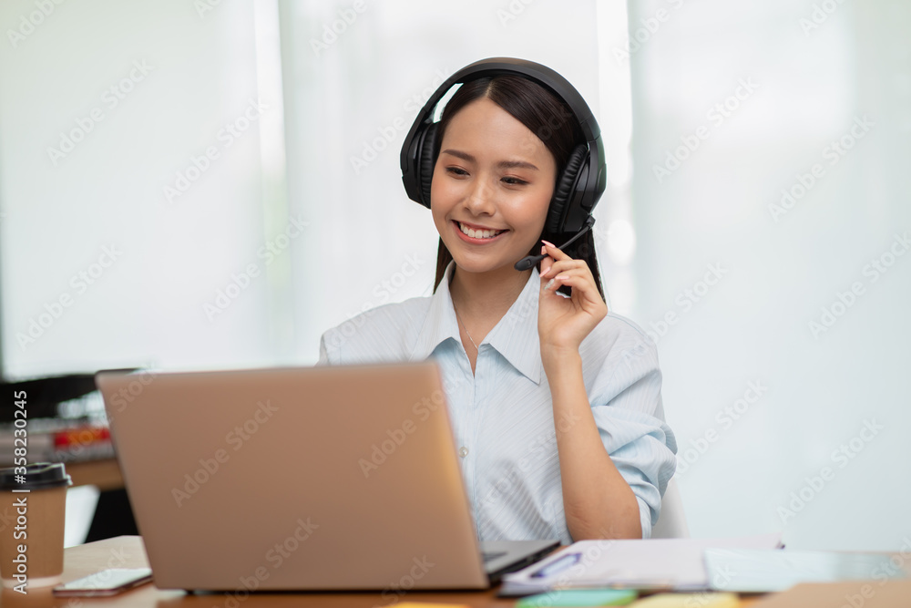 Happy Telemarketer Asian woman wear headset smile customer support Happy Telemarketer Asian woman wear headset smile customer support