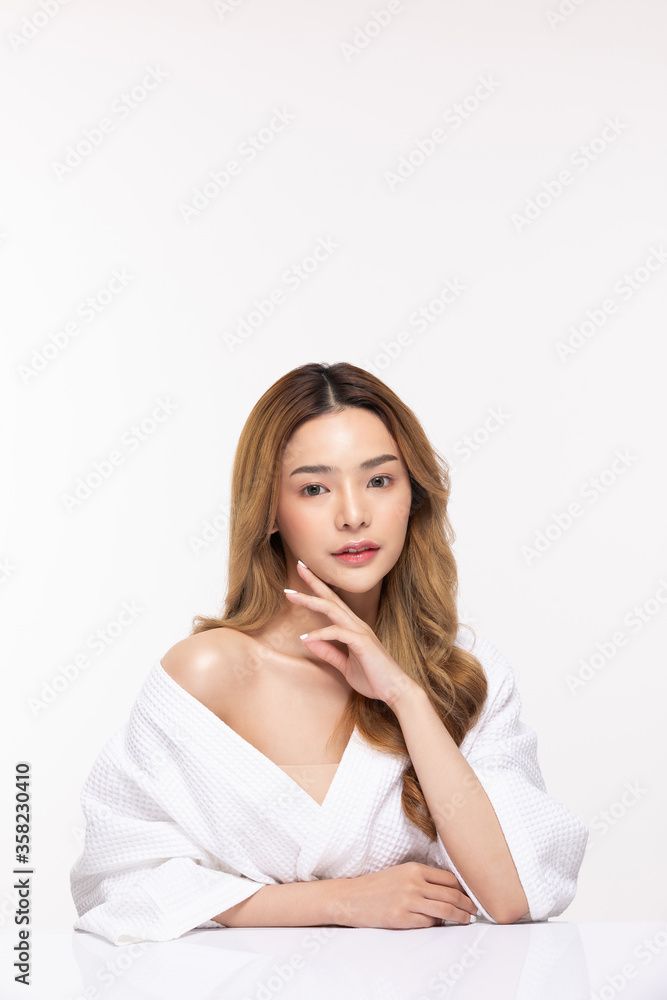 Beautiful Asian woman wearing bathrobe smile with clean fresh skin Beautiful Asian woman wearing bathrobe smile with clean fresh skin