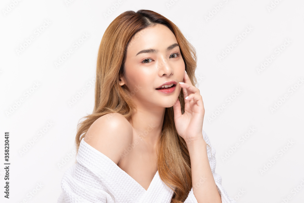 Beautiful Asian woman wearing bathrobe smile with clean fresh skin Beautiful Asian woman wearing bathrobe smile with clean fresh skin