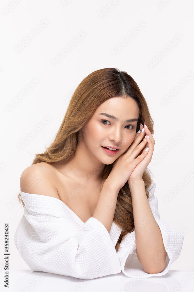 Beautiful Asian young woman holding hands smile with clean fresh skin Beautiful Asian young woman holding hands smile with clean fresh skin