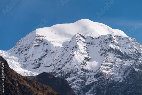 Saula mountain peak view from Lho village, Manaslu circuit trekking route in Himalaya mountains range, Nepal