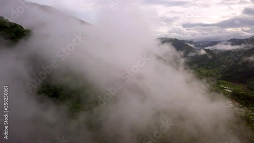 Wallpaper Mural Aerial view flying thru the morning rain cloud covered tropical rain forest mountain landscape during the rainy season on the Doi Phuka Mountain reserved national park the northern Thailand Torontodigital.ca