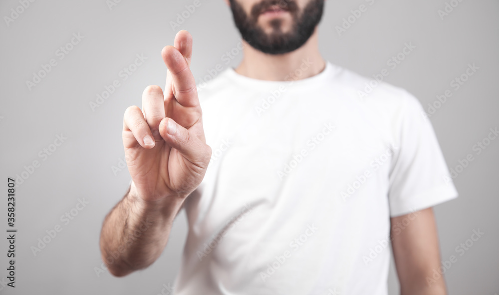 Caucasian man with fingers crossing. Caucasian man with fingers crossing.