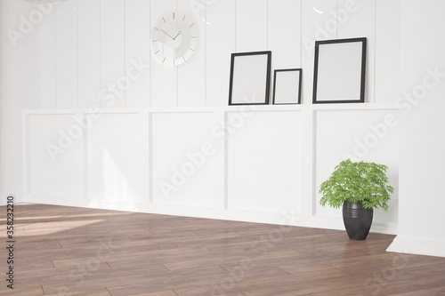 Fototapeta Naklejka Na Ścianę i Meble -  modern empty room with clock,frames,plant in black pot interior design. 3D illustration