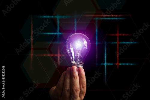 Hand finger hold ligh bulb creative technology blockchain future innovation business idea