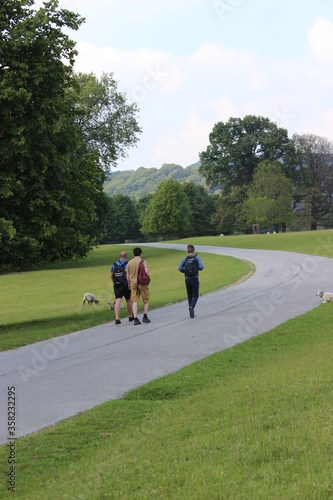 3 men walking in the country, taken in Chatsworth, Derbyshire, England 