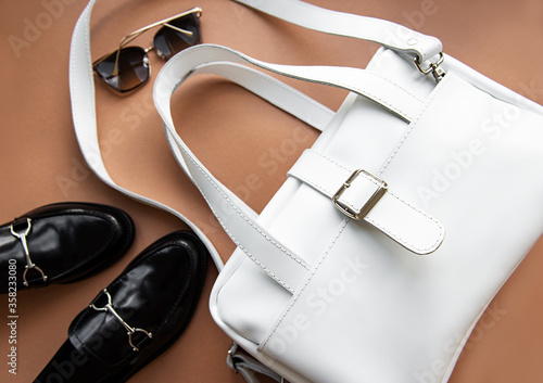 White leather bag and shoes loafer.