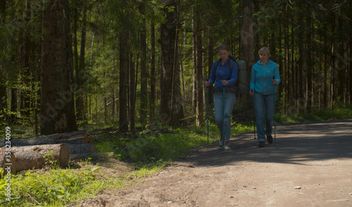 Two women on the stroll in the forest