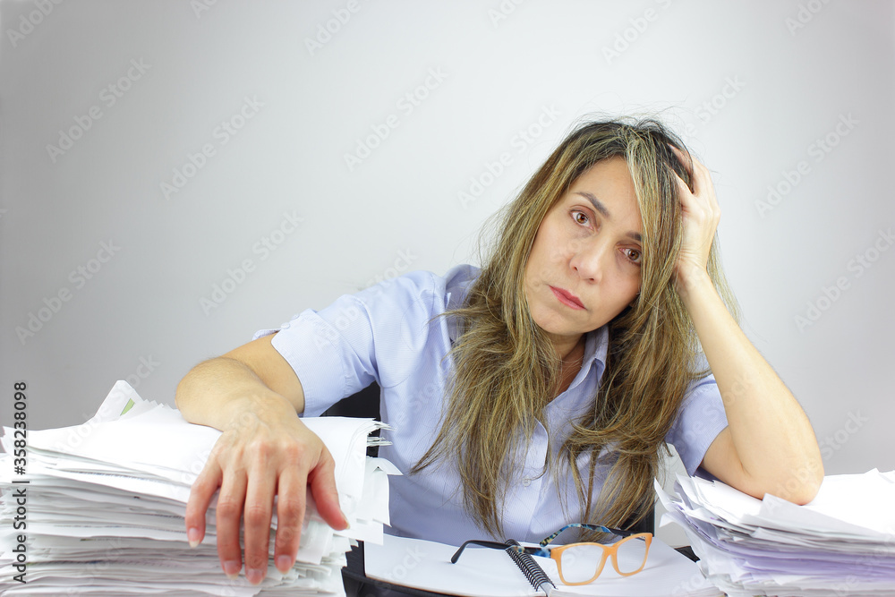 Business woman tired with all the paperwork Business woman tired with all the paperwork