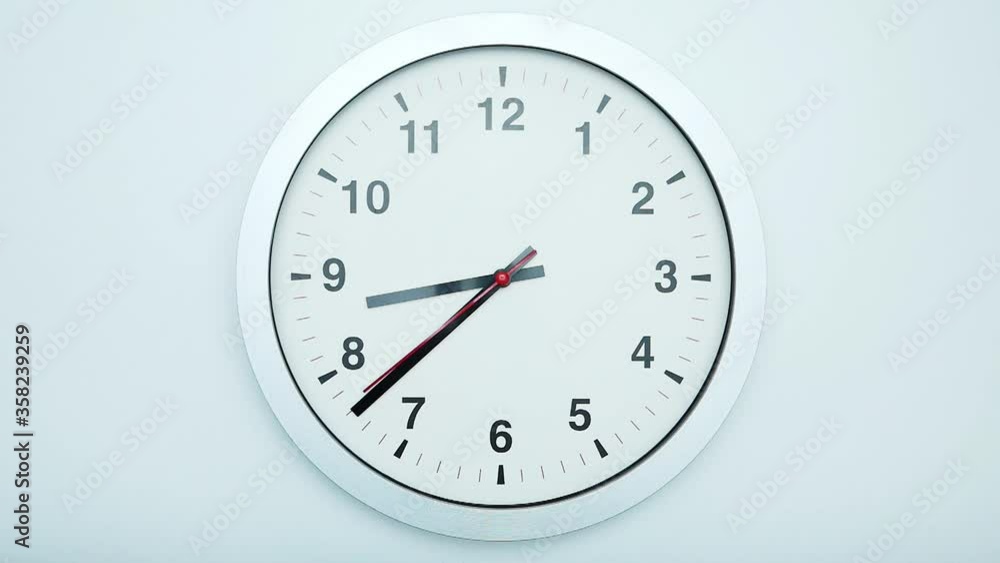 Slow motion time at 08.38 o'clock, Wall clock isolated on white background, Clock minute walk slowly, Time concept. Slow motion time at 08.38 o'clock, Wall clock isolated on white background, Clock minute walk slowly, Time concept.