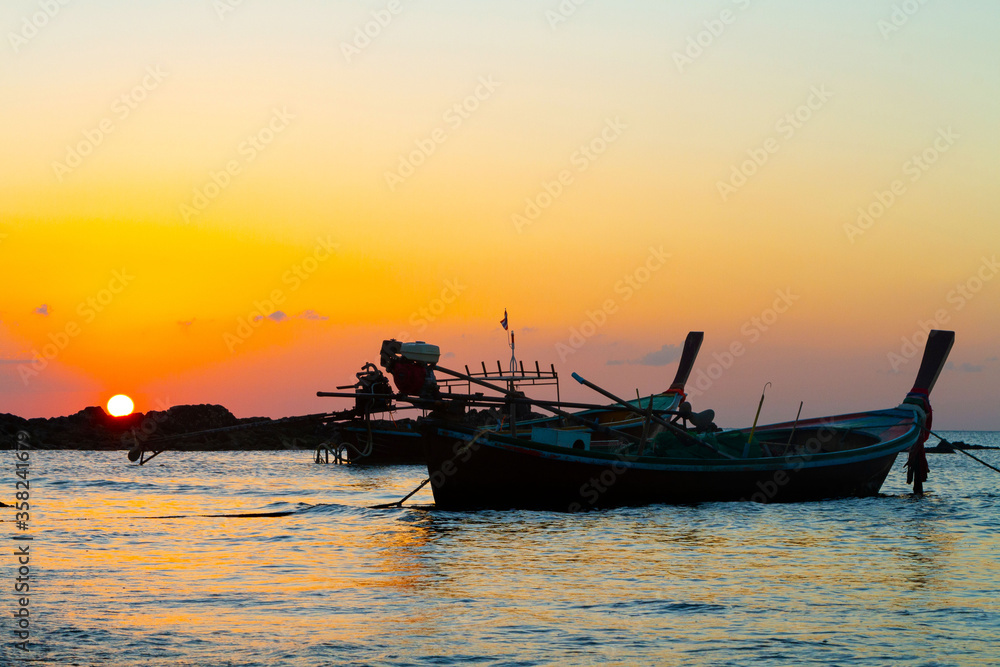 Traditional wooden boats on sunset, Koh Lanta, Thailand