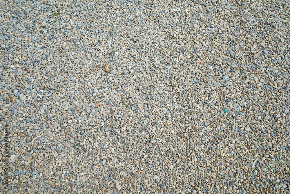 Close up detail and surface of Gravel pebbles stone and small granite rock Close up detail and surface of Gravel pebbles stone and small granite rock