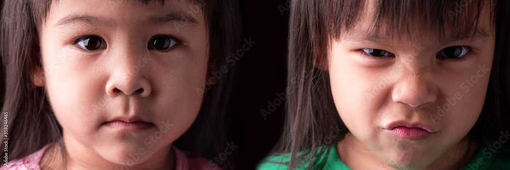 Portrait half face of Asian sibling child girls with sad and angry expression on dark background. Portrait half face of Asian sibling child girls with sad and angry expression on dark background.