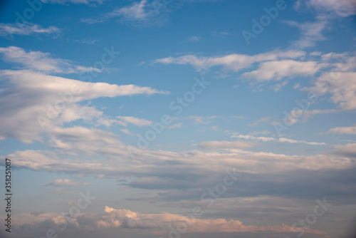Full frame blue cloudy sky as backdrop. © FO_DE