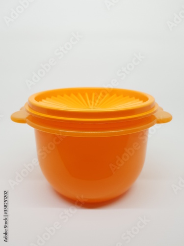 colorful plastic container over white background