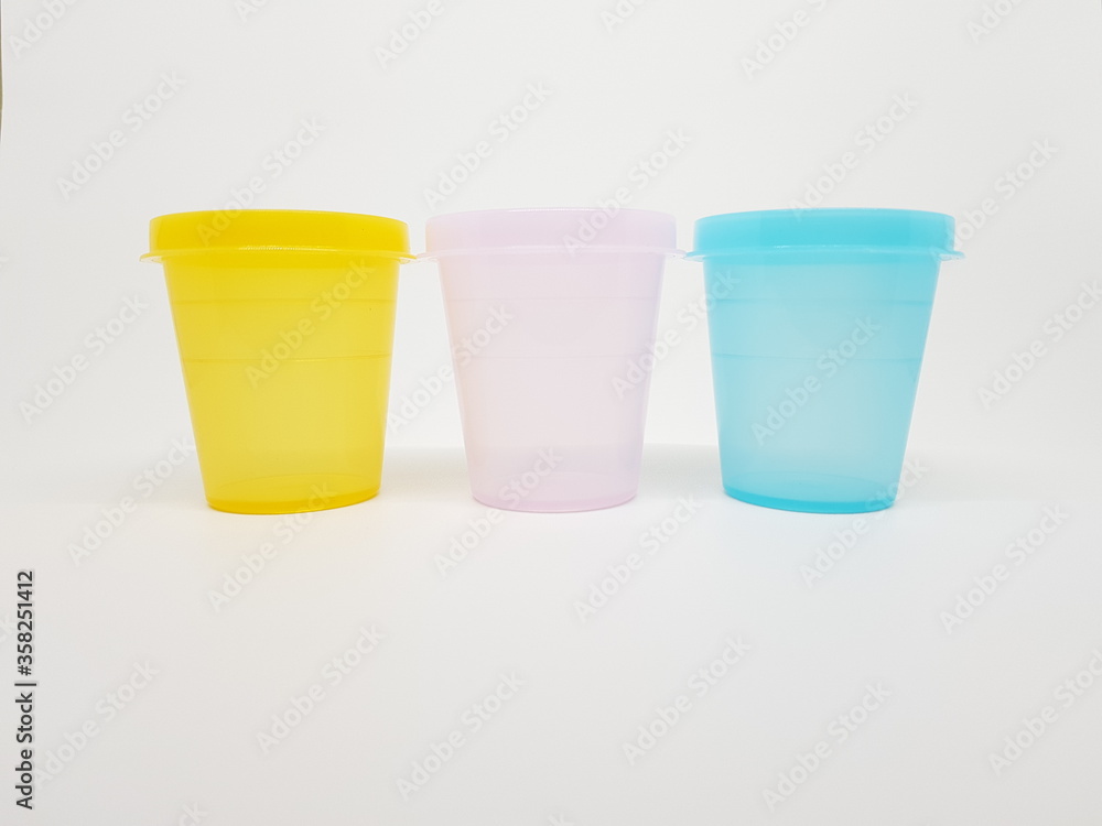 colorful plastic container over white background colorful plastic container over white background