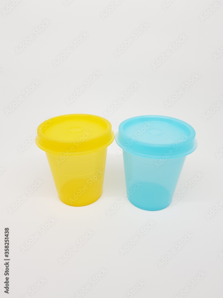 colorful plastic container over white background colorful plastic container over white background