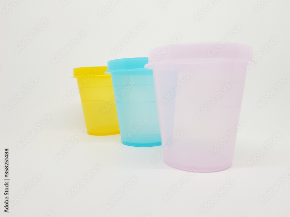 colorful plastic container over white background colorful plastic container over white background