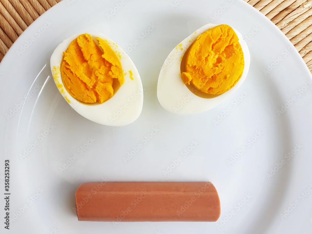 Funny face out of food. A sad face of eggs and sausage. Funny face out of food. A sad face of eggs and sausage.