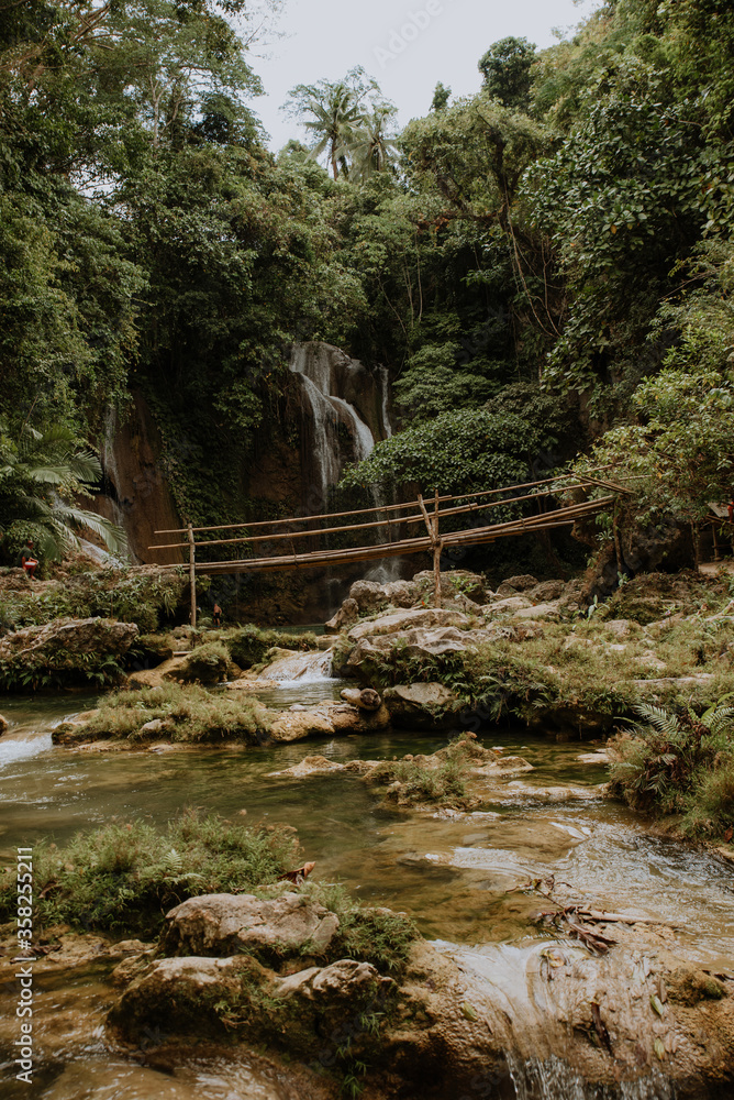 nature stamp with a beautiful waterfall on the island of bohol in the philippines nature stamp with a beautiful waterfall on the island of bohol in the philippines